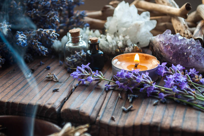 Herbs and candles used in wicca herbal magic.