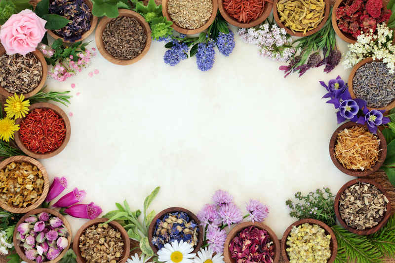 Herbs used for attracting good luck on a white table.