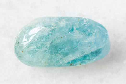 A light blue aquamarine crystal with magical and metaphysical properties. 