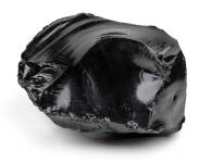 A black obsidian stone on a white background. 