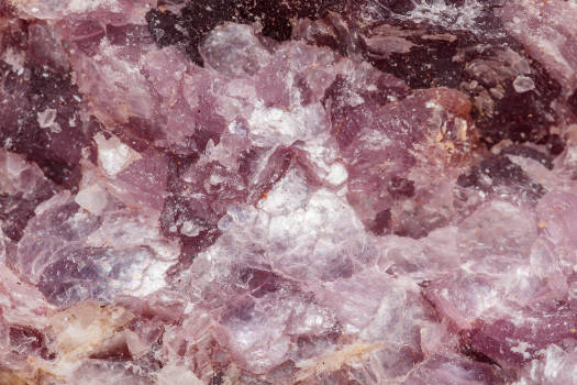 A macro shot of purple lepidolite crystal with magical and metaphysical properties. 