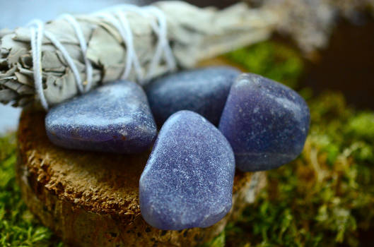 Blue lepidolite gemstones outdoors with magical and metaphysical properties.  