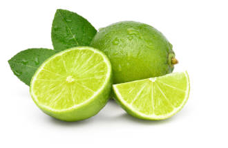 A whole lime and a freshly sliced lime. 