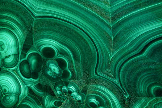 A macro shot of a green Malachite crystal with magical and metaphysical properties. 