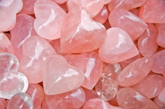A bunch of pink rose quartz crystals with magical and metaphysical properties. 