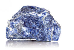 A blue sodalite stone on a white background. 