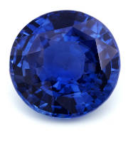 A blue sapphire stone on a white background. 