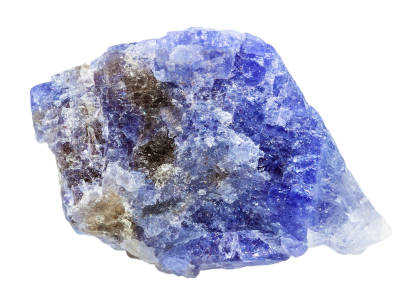 A natural blue Tanzanite crystal isolated on a white background.  