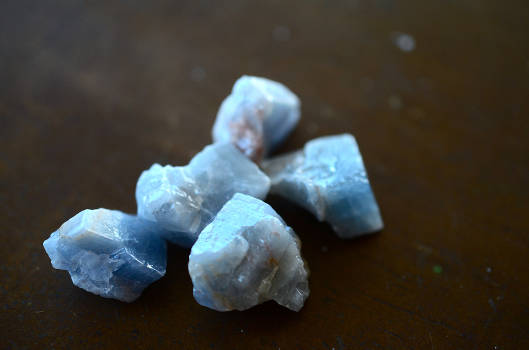 Five blue calcite crystals with healing and metaphysical properties. 