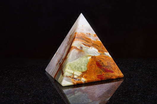 An onyx pyramid stone with magical and metaphysical properties. 